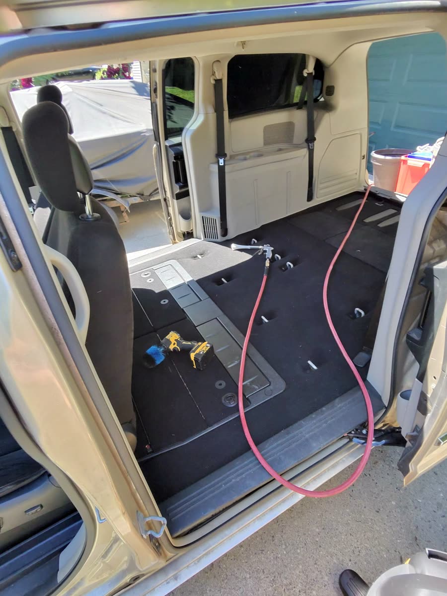 Dodge Caravan — seats stowed, floor being done