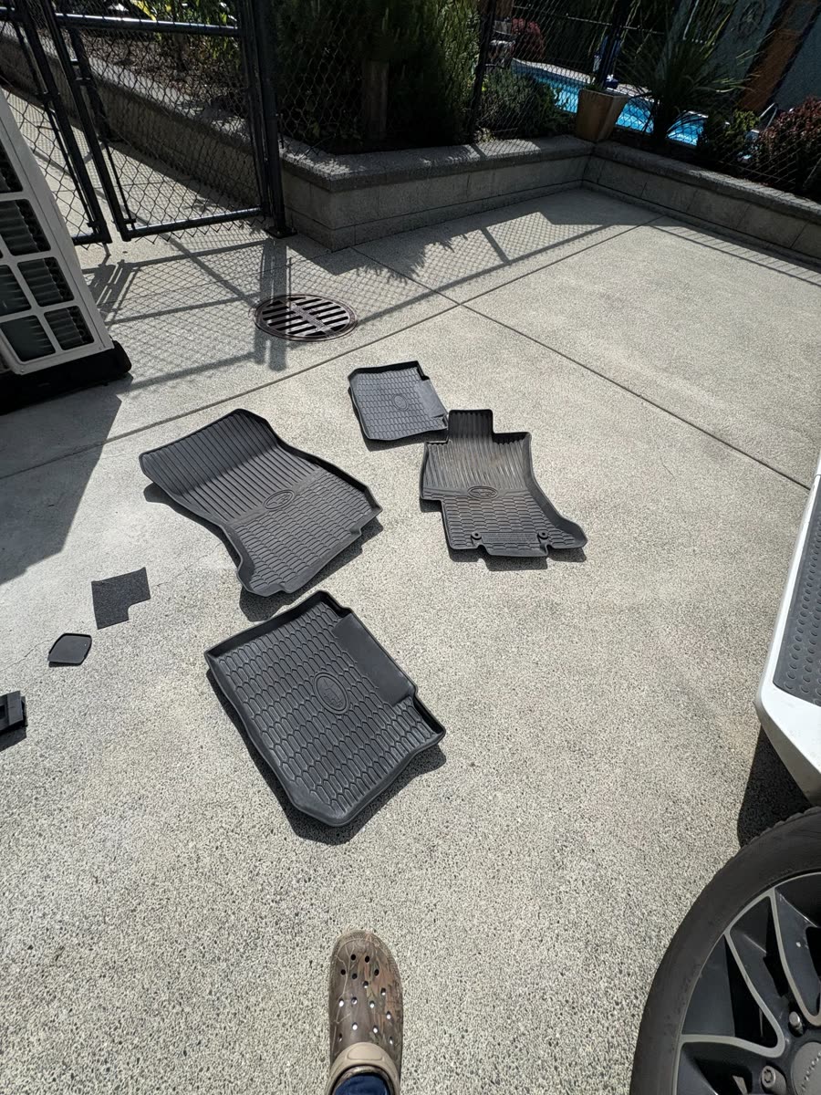 Subaru WRX — mats out on the driveway