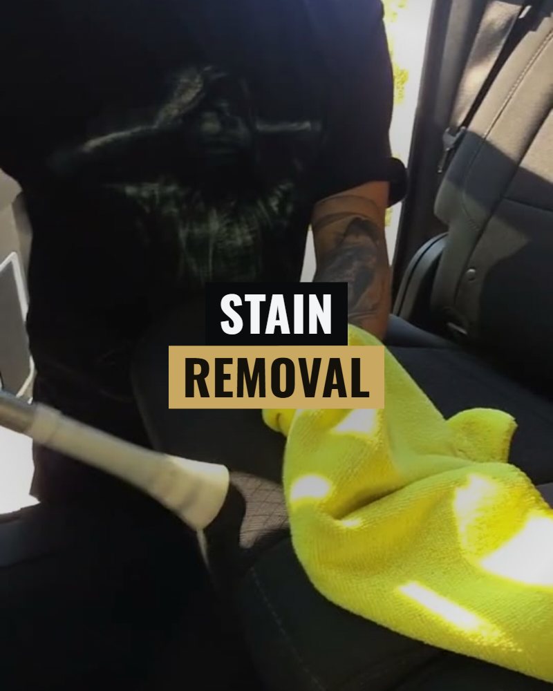Stain removal: the stain being blown out of the seat into a cloth