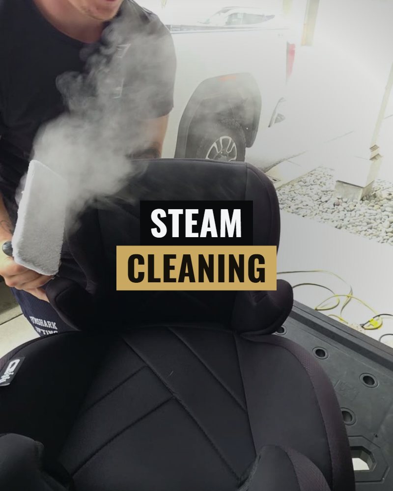 Steam cleaning: a child car seat being steamed